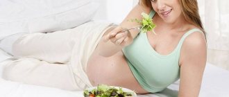 Pregnant girl eating salad