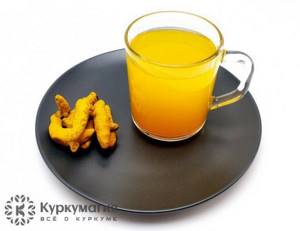 A glass of water with turmeric
