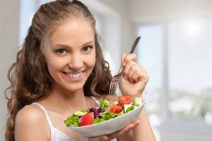 Girl eating salad