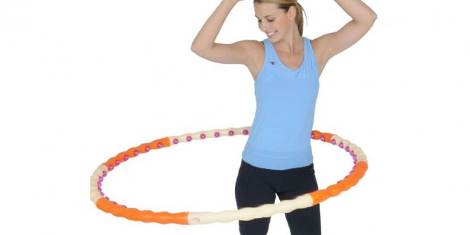 Girl spins a hula hoop