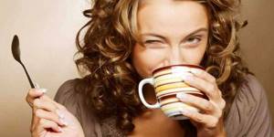 Girl drinks tea from a cup