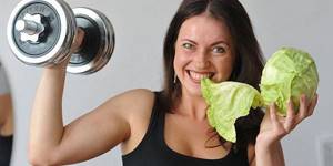Girl with cabbage and dumbbells