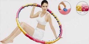 Girl with a massage hoop for belly slimming