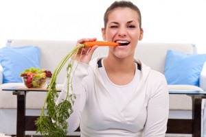 Girl with a carrot - Carrots for weight loss