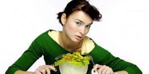 Girl with a plate of salad