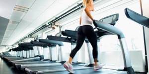 Girl in the gym on a treadmill
