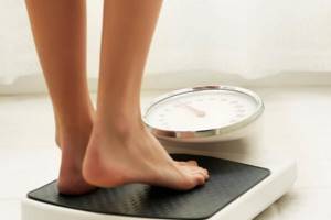 Girl weighs herself
