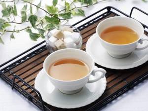 two cups of tea with sugar