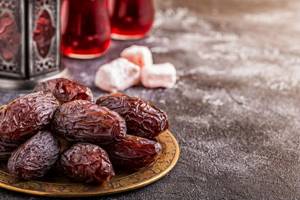 dates in a plate, marmalade on the background