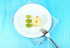 pear and grapes on a plate