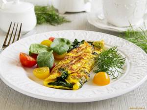 What is the calorie content of an omelet for 2 eggs?