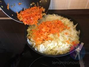cabbage, carrots and onions in a frying pan