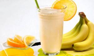 Cocktail of oranges and bananas with milk