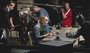 Christian Bale, Heath Ledger and Christopher Nolan on the set of The Dark Knight