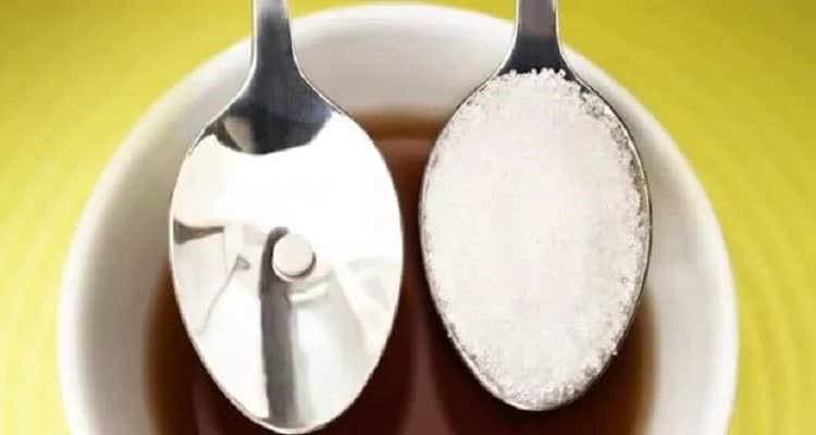 Spoon with sugar and sugar substitute