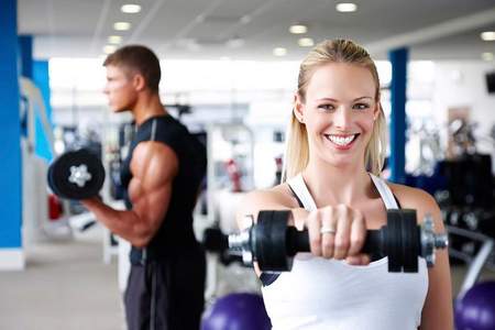 man and woman in the gym