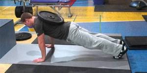 Man doing push-ups with weights