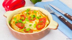 Omelet with tomatoes is a tasty and bright dish.