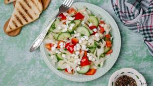 Salad of cottage cheese and vegetables is an easy side dish.