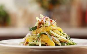 Salad with fresh and sauerkraut, oranges and nuts