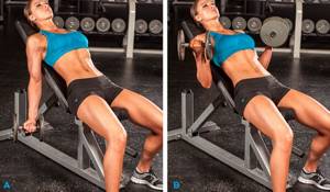 Arm curls with dumbbells lying on an incline bench