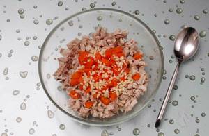 Mix chicken, carrots, salt, pepper and garlic