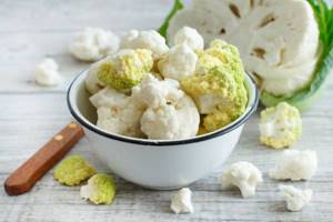 cauliflower inflorescences in a bowl on the table