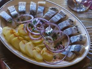 Salted herring. Calorie content per 100 grams, dietary supplements, benefits, harm. Recipes with onions, vinegar, oil 