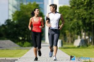 Boy and girl jogging together