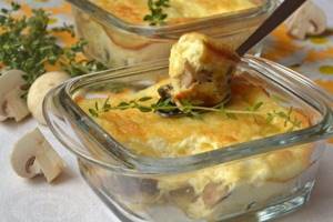 Chicken soufflé in the oven. Dietary recipe, like in kindergarten with vegetables, cereals, mushrooms 