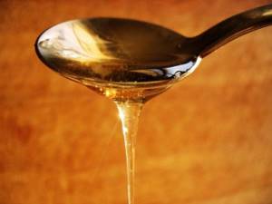 How many grams of honey are in a tablespoon?