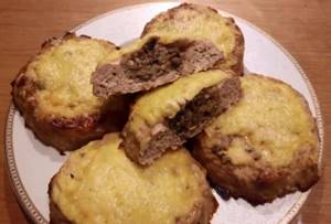 Delicious pork cutlets with mushrooms and cheese in the oven