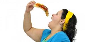 Woman eating pizza